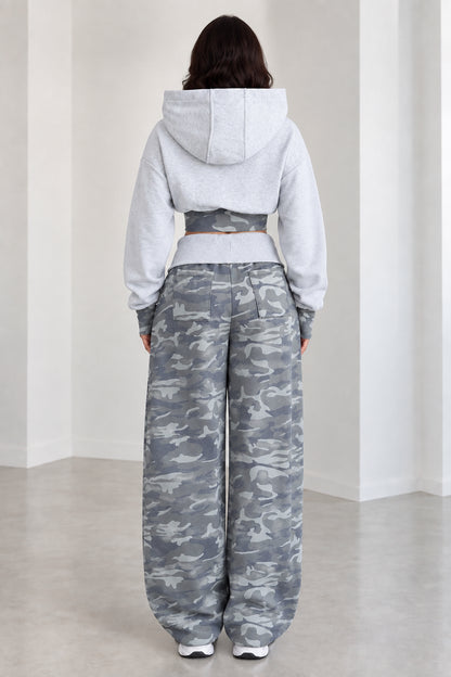 Back view of model wearing Heather Grey cropped hoodie and camo sweatpants set