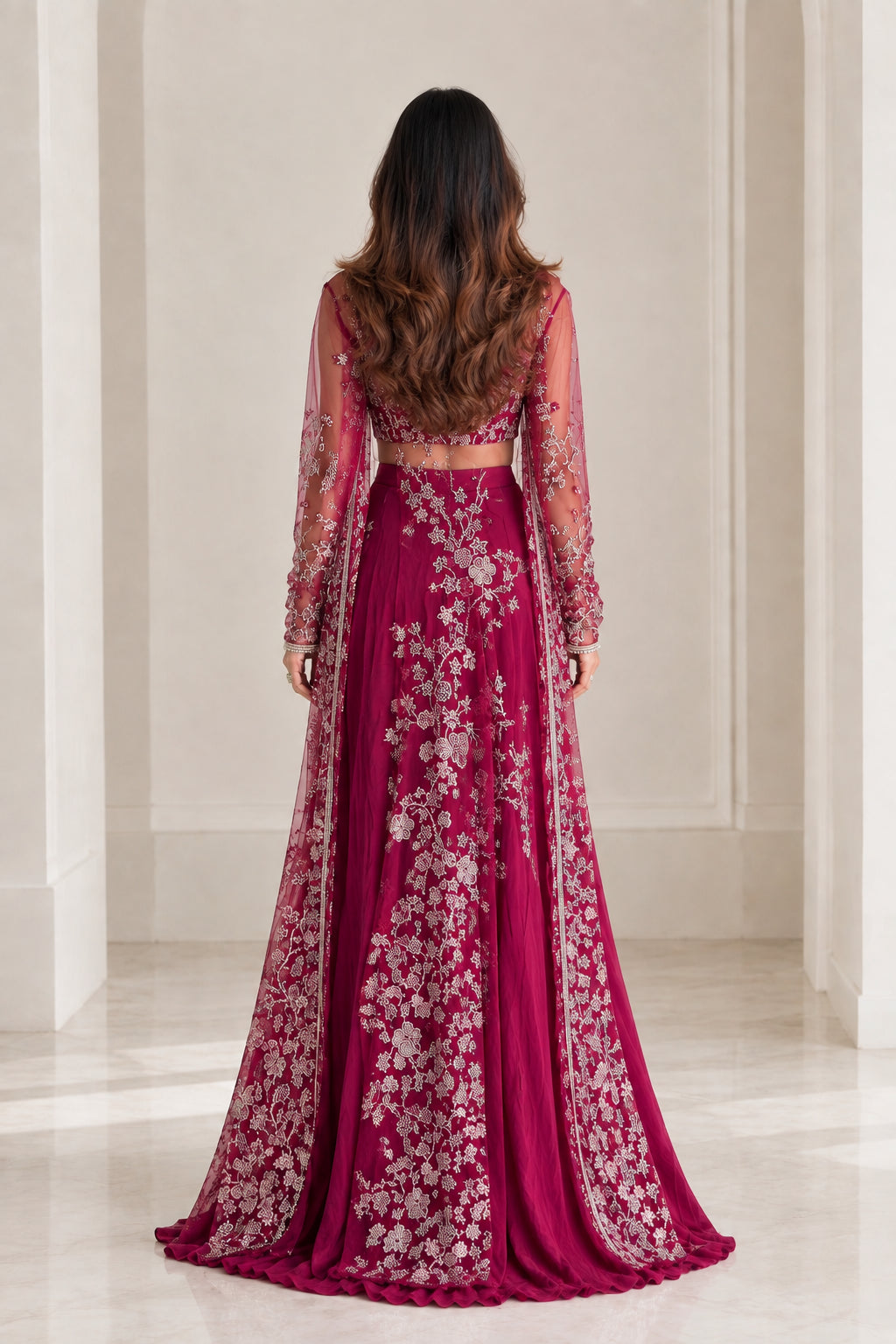 Back view of model wearing magenta embroidered duster cape and matching palazzo pants