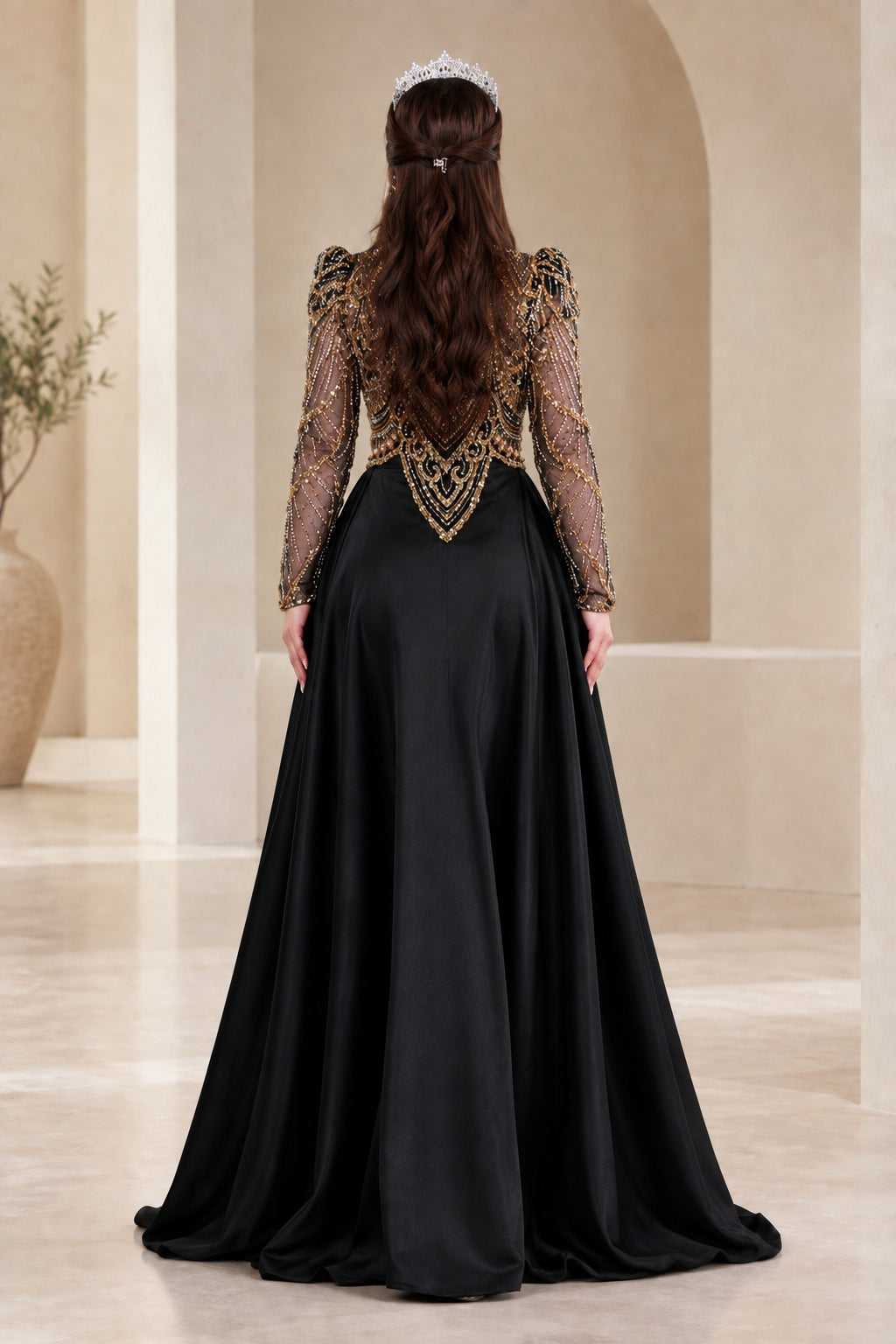 Back view of black formal gown highlighting structured shoulders and flared skirt drapery