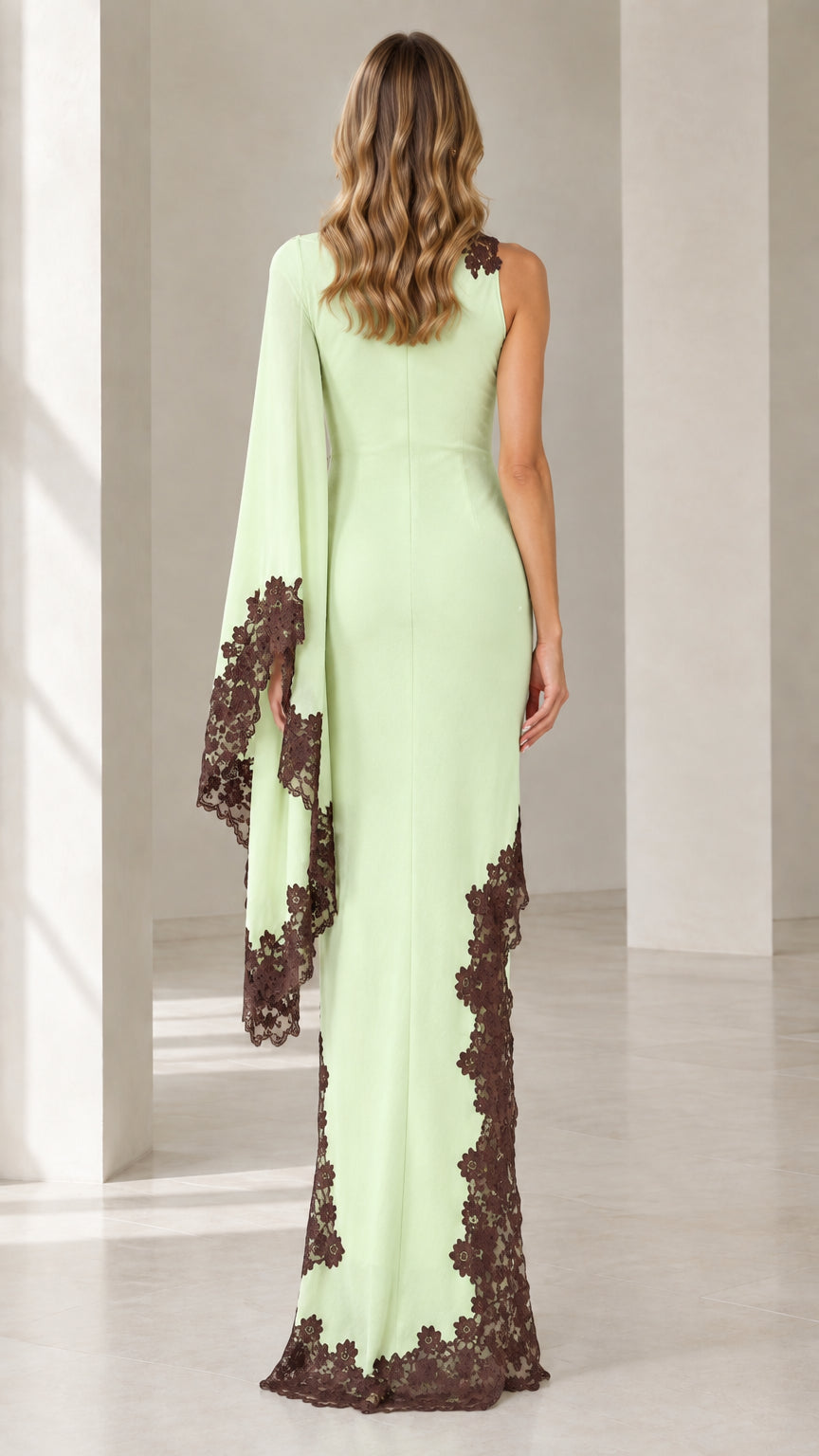 Back view of mint green evening dress with one draped cape sleeve and fitted silhouette