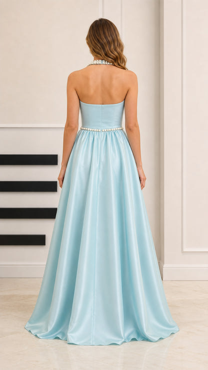 Back view of light blue halter backless evening gown showing skirt drape