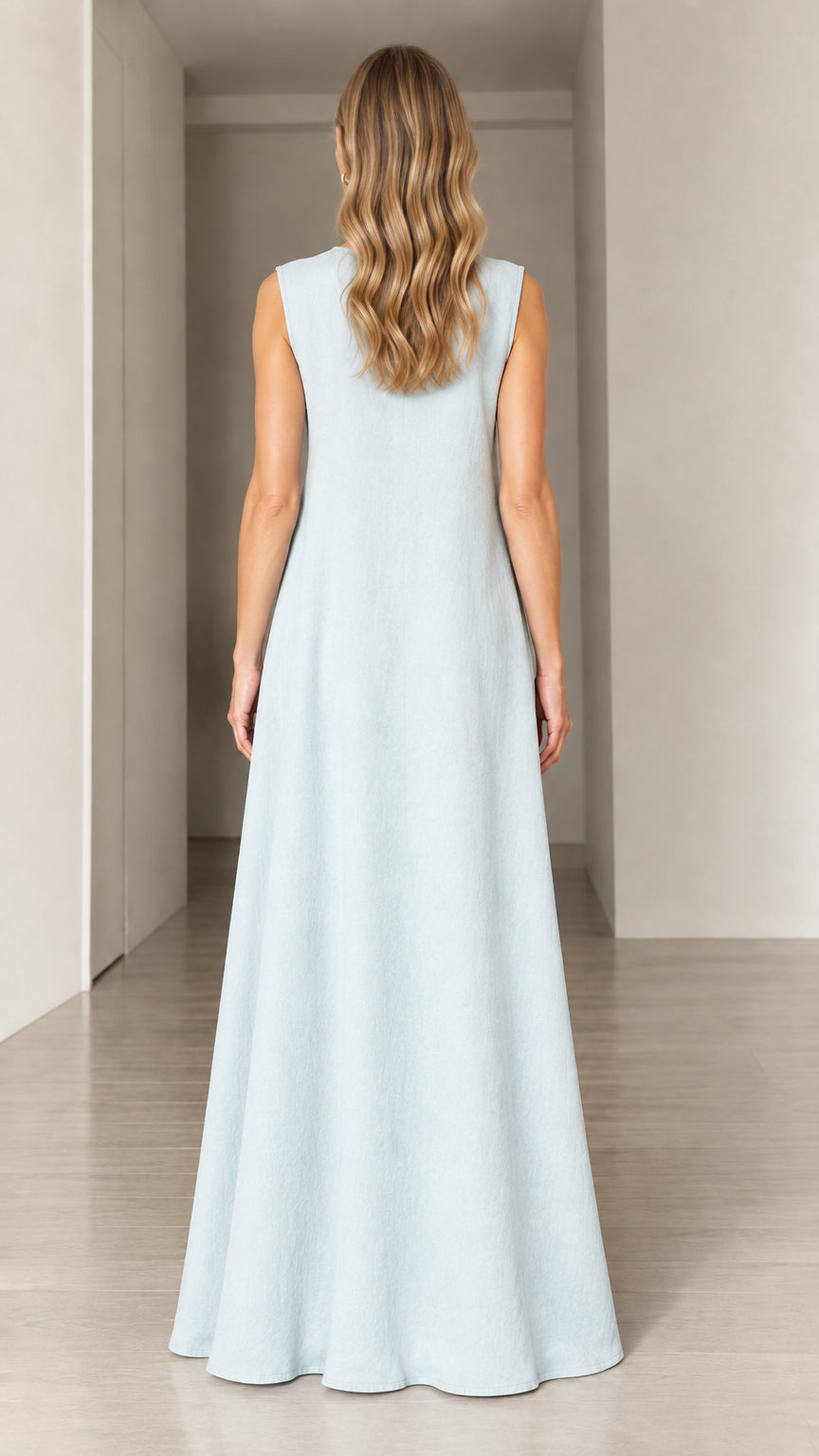 Back view of woman wearing Light Blue flowy sleeveless maxi dress