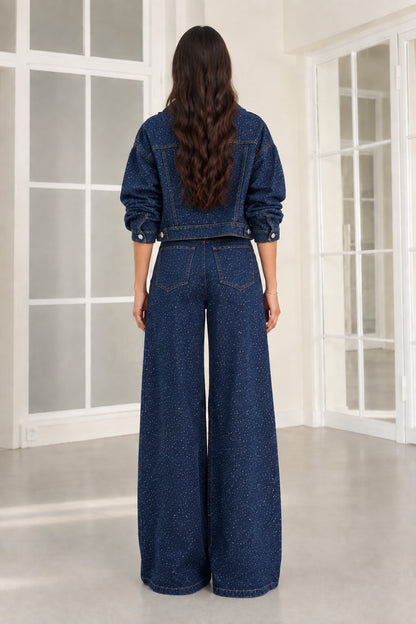 Back view of dark blue rhinestone cropped jacket and wide-leg denim pants