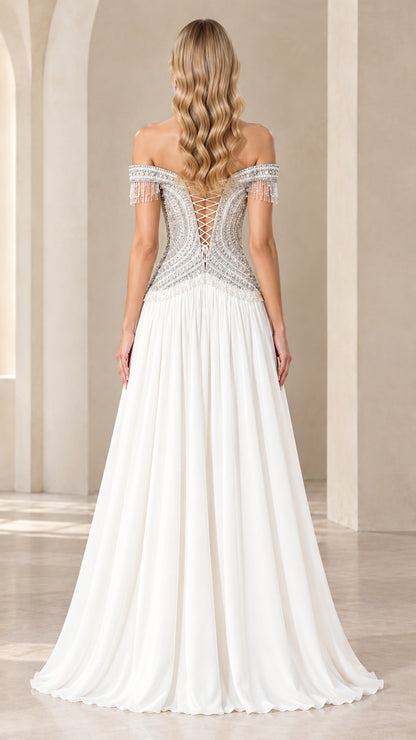 Back view of white formal gown showcasing lace-up corset back and beaded details