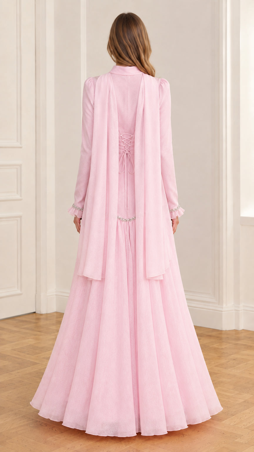 Rear view of pink evening gown highlighting cape drapes and lace-up back
