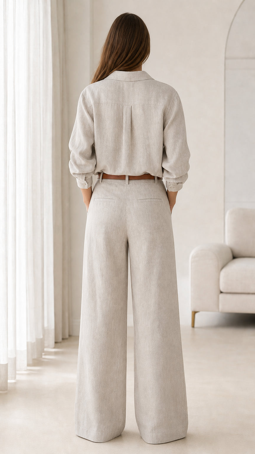 Back view of beige relaxed fit long-sleeve shirt and wide-leg trousers