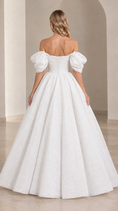 Back view of white formal gown showing lace-up corset detail