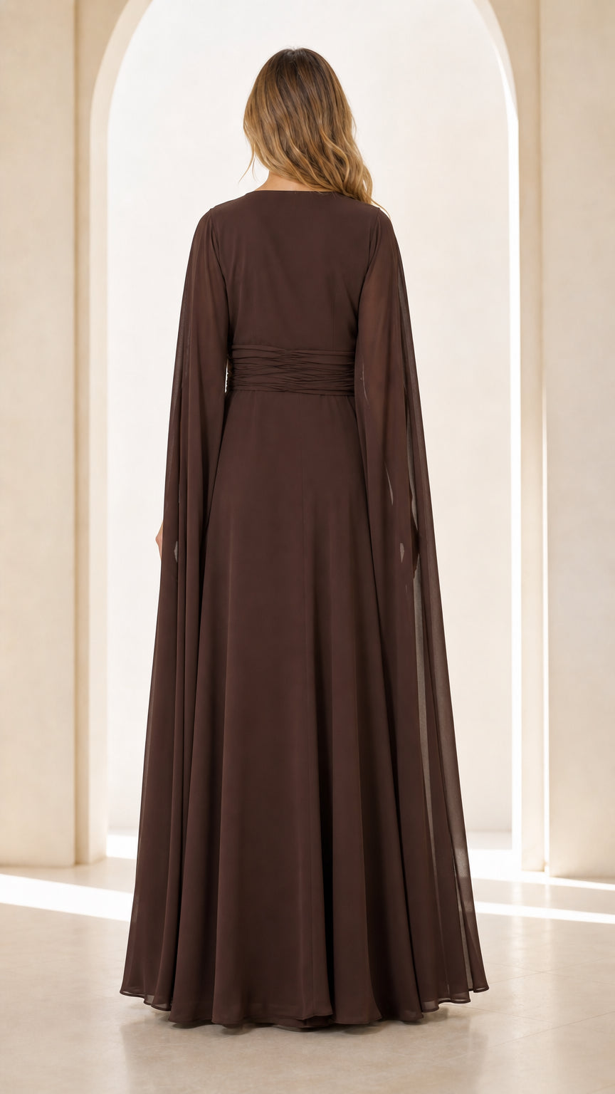 Back view of model wearing Chocolate Brown cape sleeve maxi gown