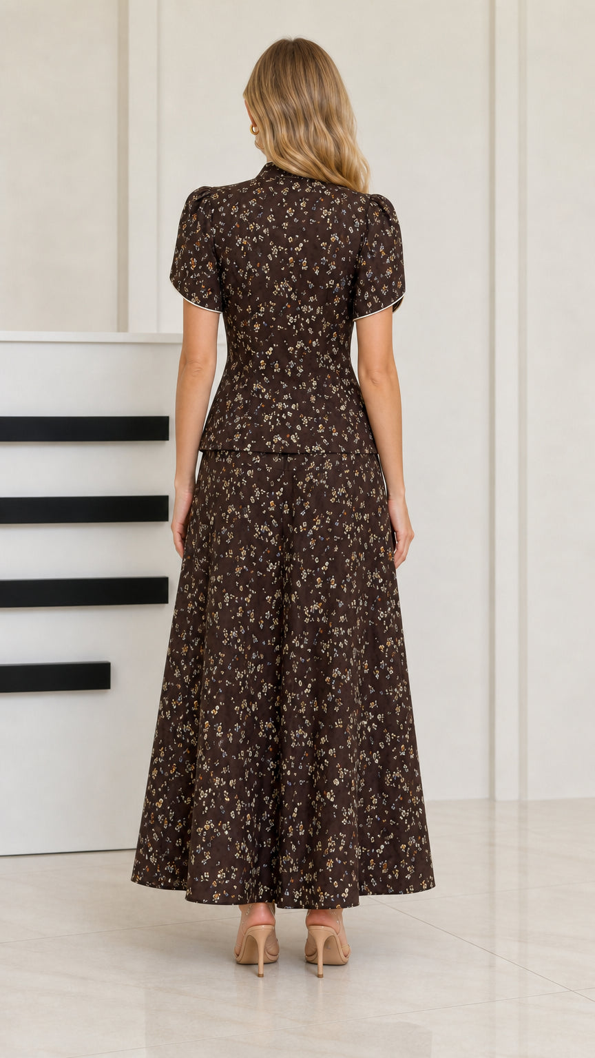 Back view of woman wearing dark brown floral maxi skirt and top set