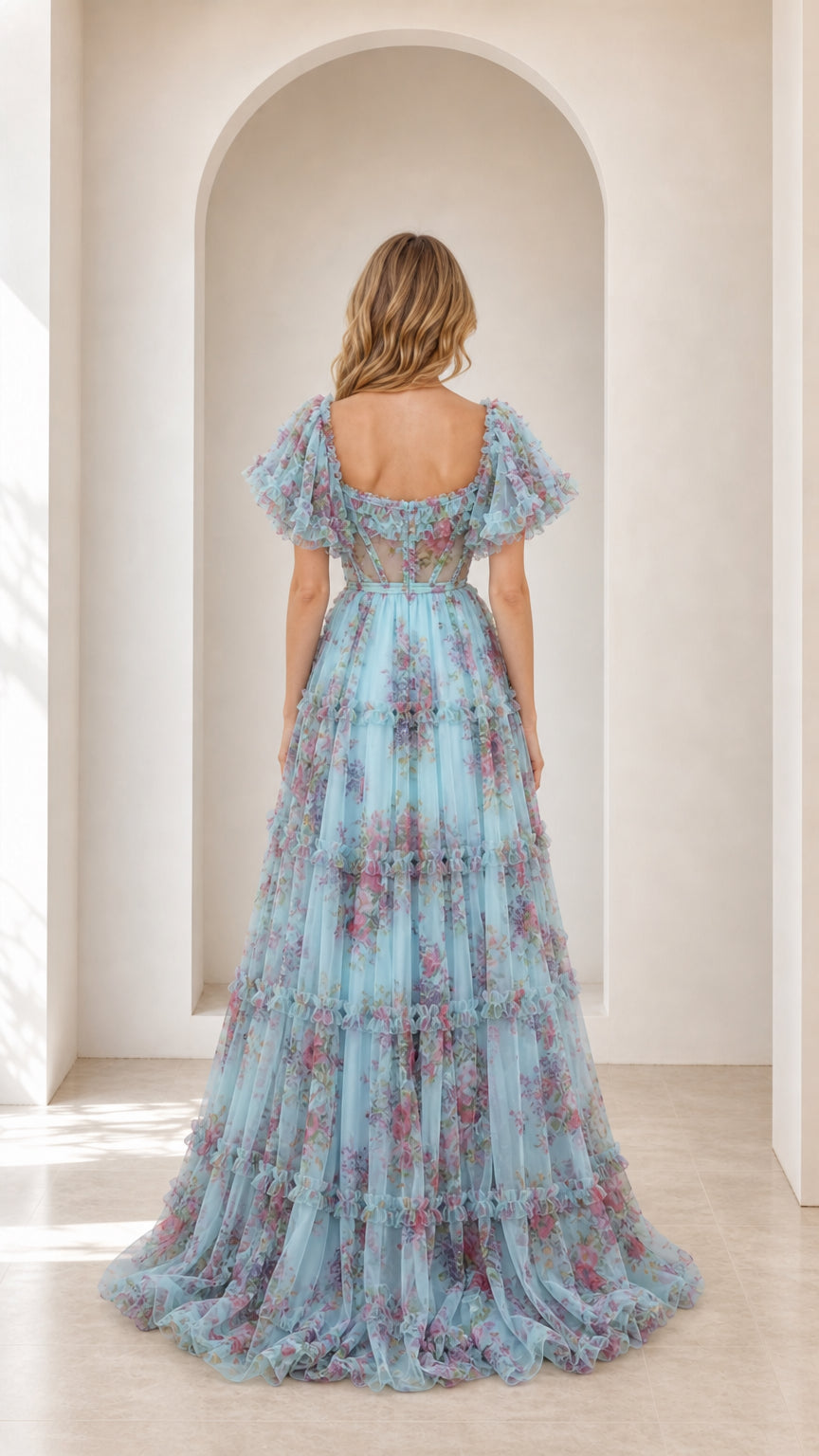 Back view of model wearing light blue floral tulle gown with square back