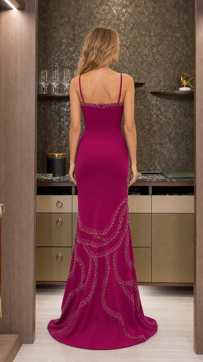 Back view of the magenta formal mermaid gown showing slender straps and fitted silhouette