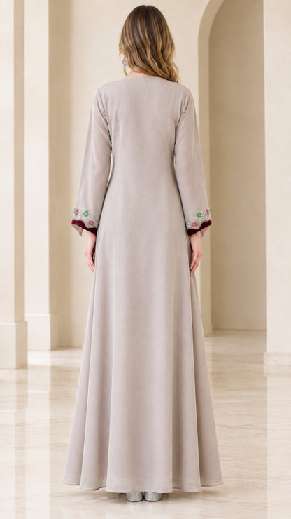 Back view of beige flowing full-length kaftan dress