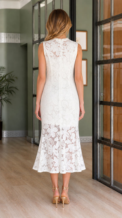 Back view of model wearing white floral lace midi dress with back zipper