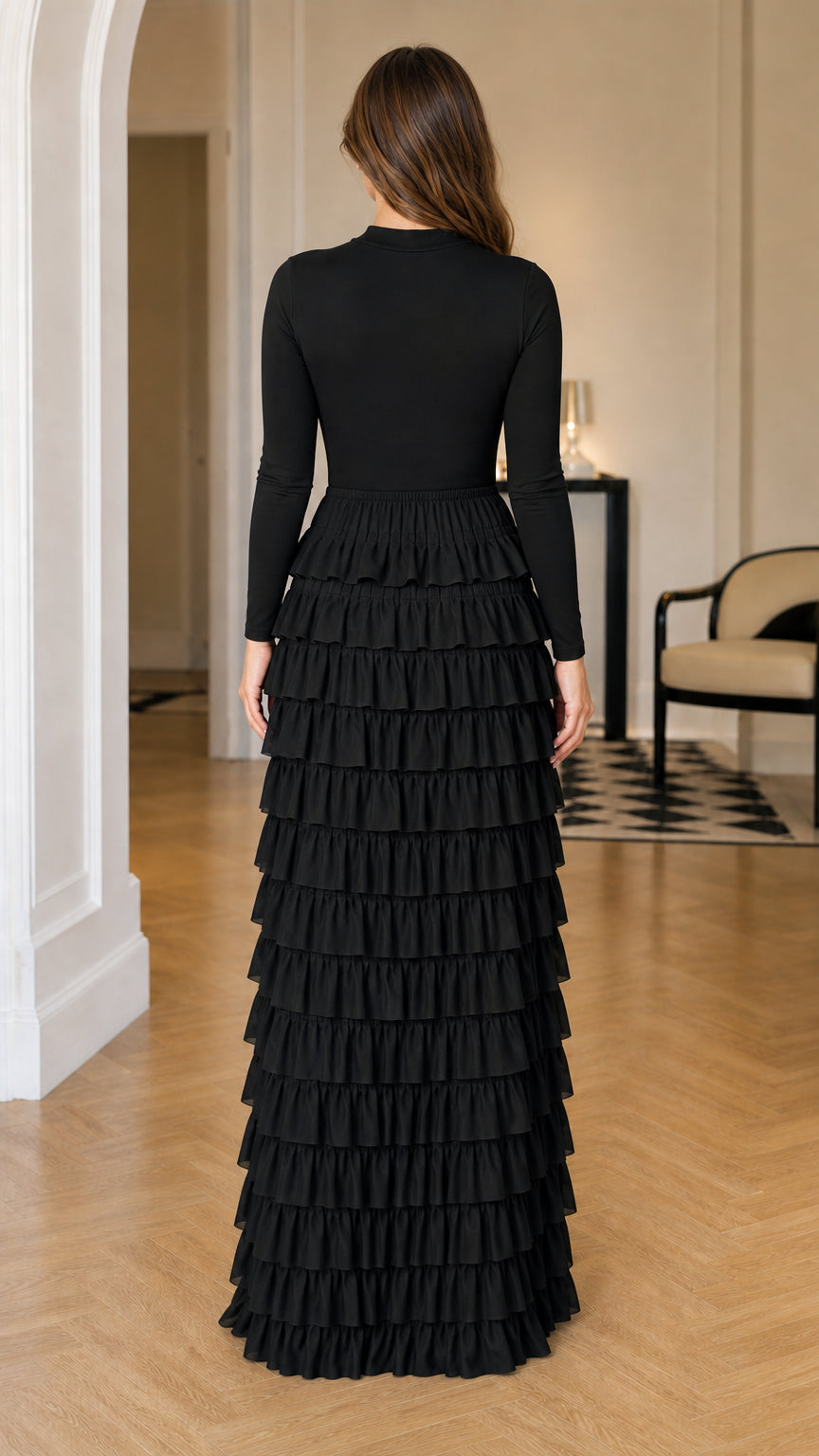 Back view of a black fitted long sleeve dress with tiered ruffle maxi skirt