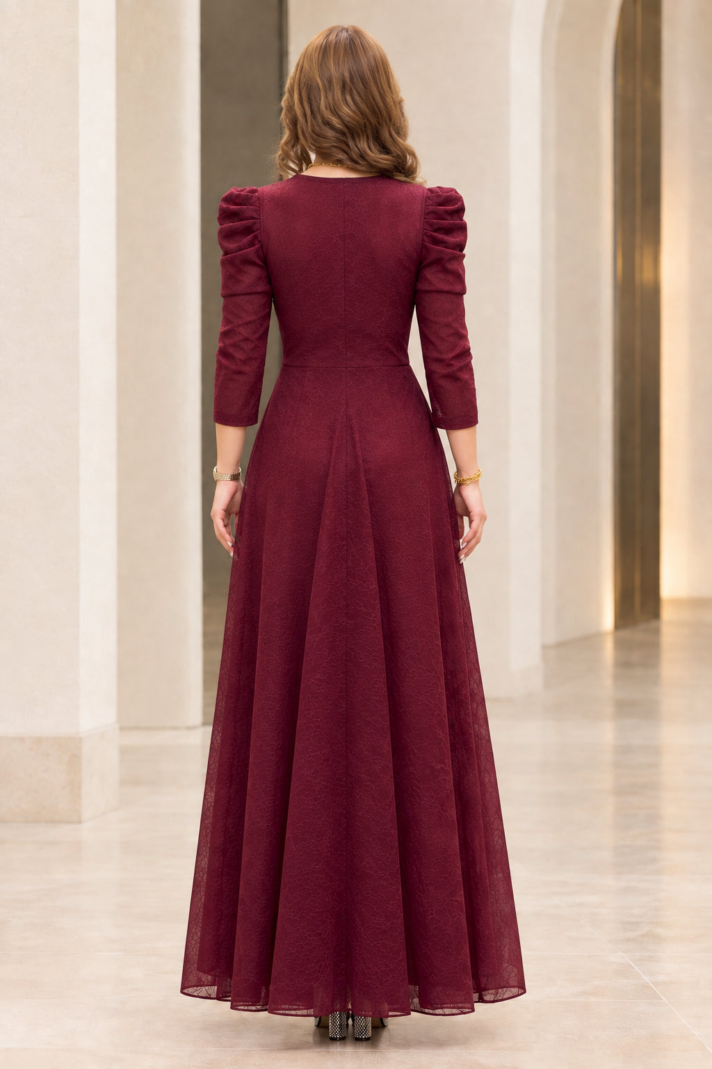 Back view of model wearing burgundy textured formal maxi dress