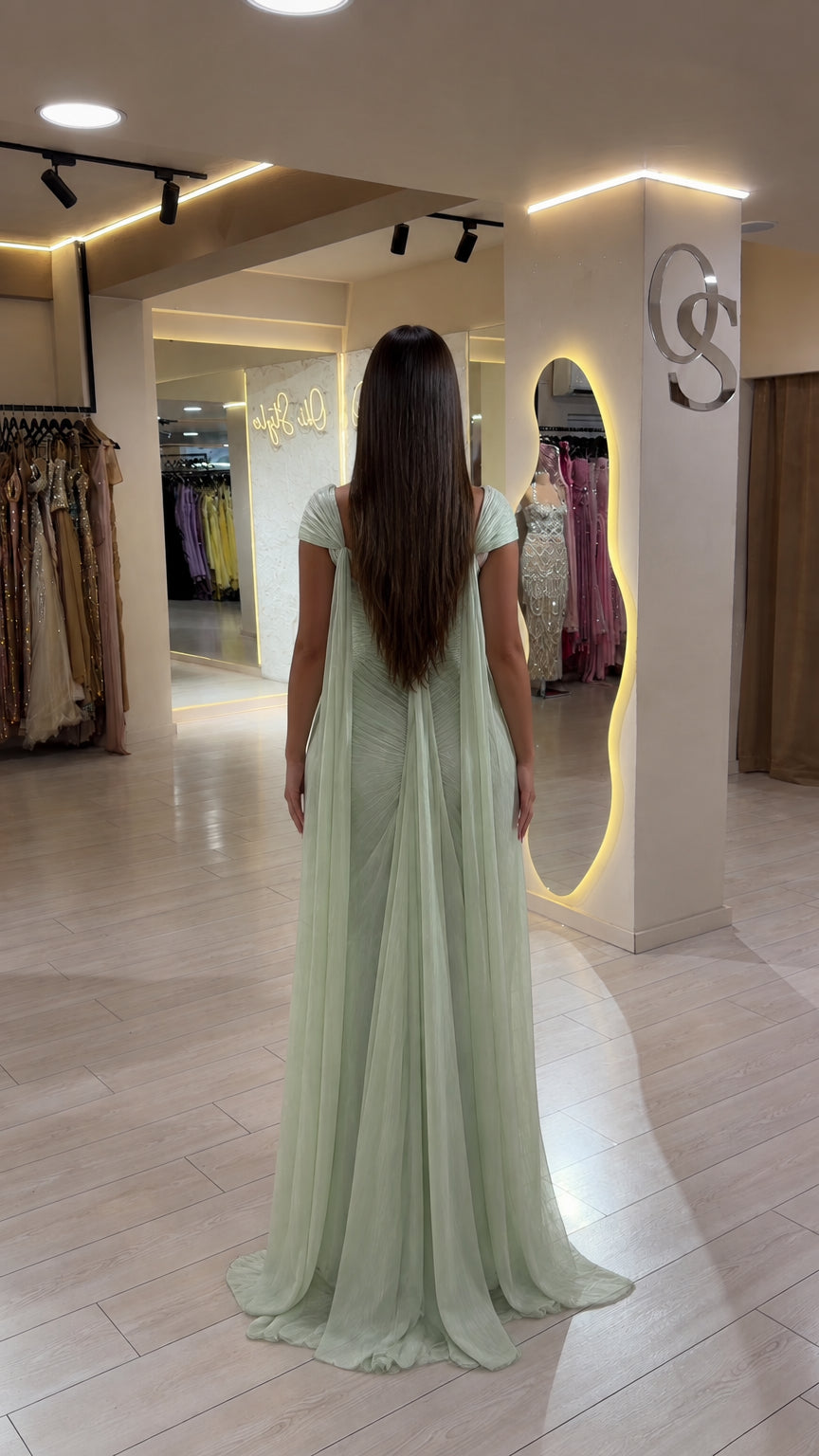 Back view of Sage Green evening gown showing long flowing cape sleeves