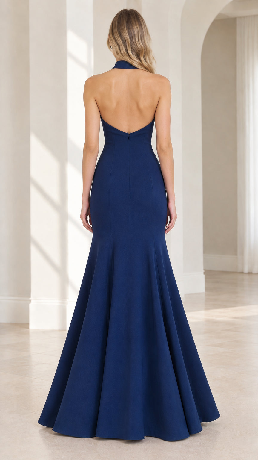 Back view of model showing open back design on Navy Blue formal gown