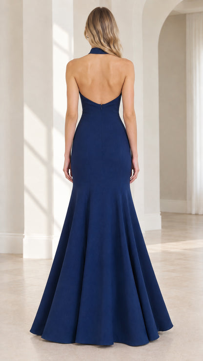 Back view of model showing open back design on Navy Blue formal gown
