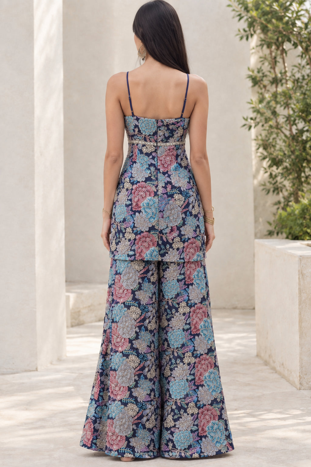 Back view of model showcasing Navy Blue floral strap tunic top and wide-leg pants set