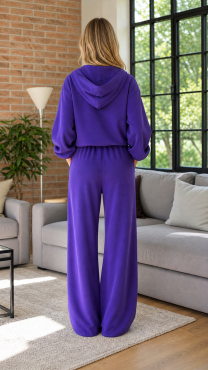 Model wearing purple hoodie and wide leg lounge pants back view