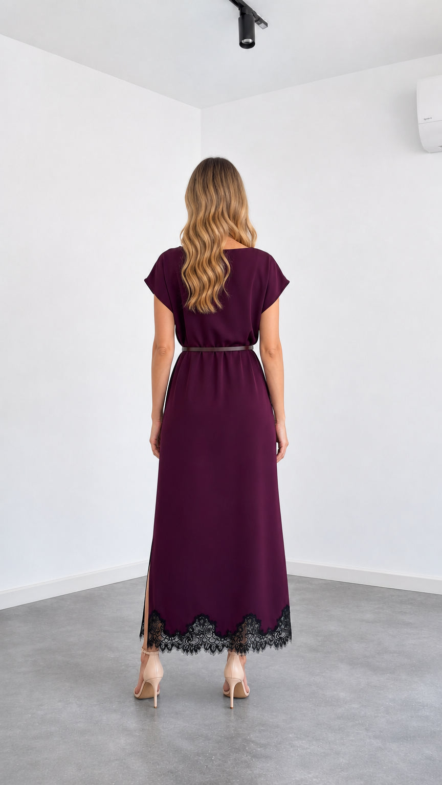 Back view of woman wearing burgundy cap sleeve maxi dress