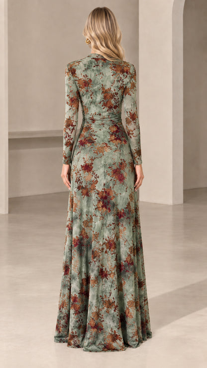 Back view of woman wearing sage green floral long sleeve maxi dress