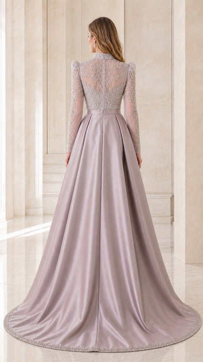 Back view of model in dusty lilac beaded high neck gown with voluminous satin train