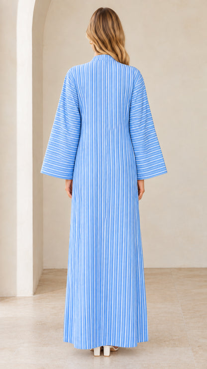 Back view of woman wearing sky blue striped kaftan dress with wide sleeves