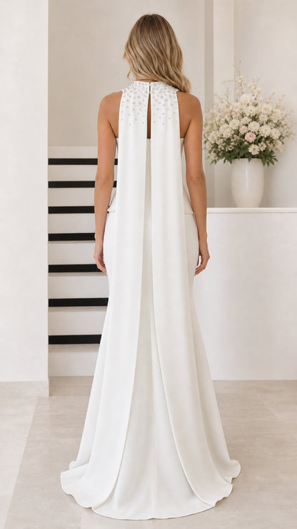 White formal evening dress back view showing embellished neck and cape train