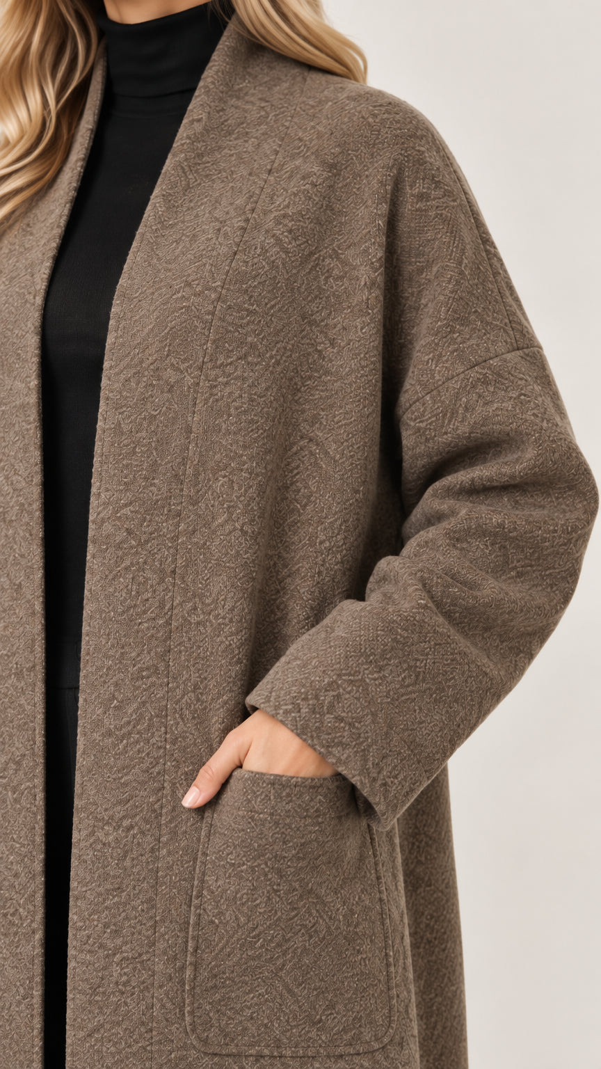 Close-up detail of textured fabric and pocket on mocha coatigan