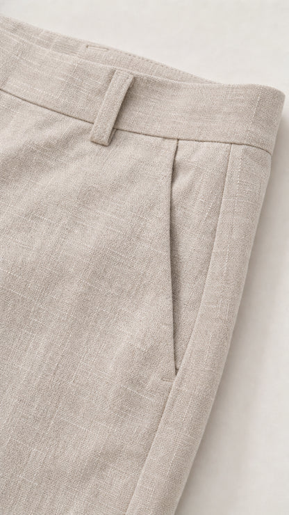 Close-up detail of textured linen-look shorts waistband with belt loops and pocket