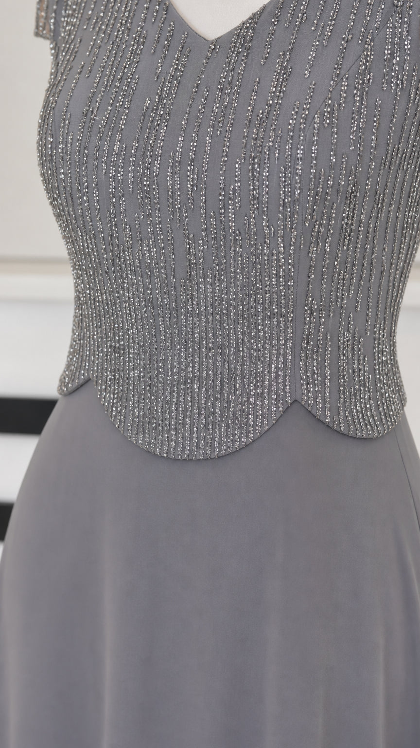 Close-up detail of Slate Gray beaded bodice with scalloped waist trim