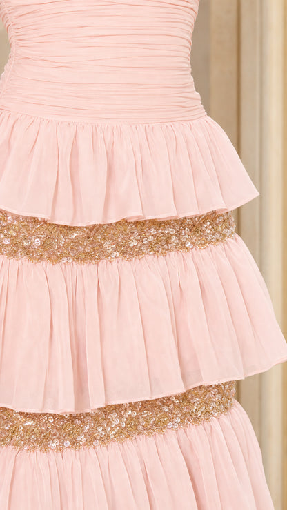 Close-up detail of ruffled tiers and sequin trim