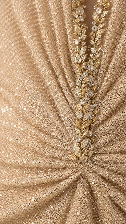 Close-up detail of rhinestone and leaf-beaded neckline