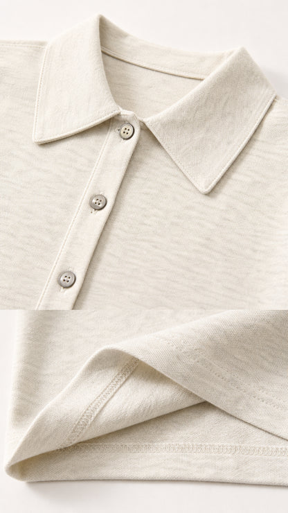 Close-up detail of polo collar buttons and knit fabric texture