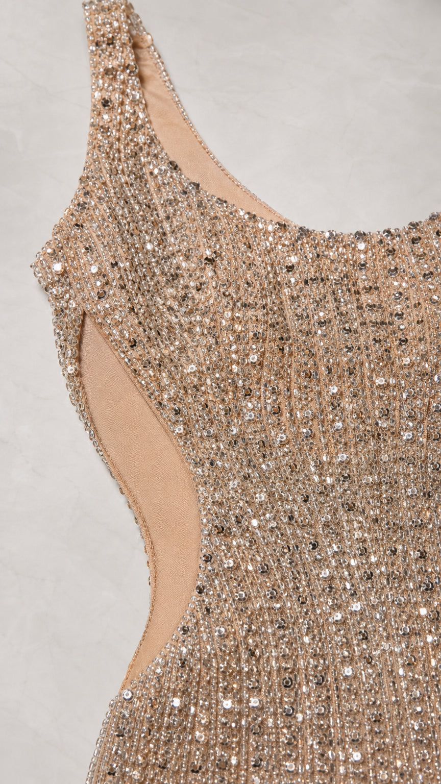 Close-up detail of champagne sequin embroidery and sheer mesh cutout