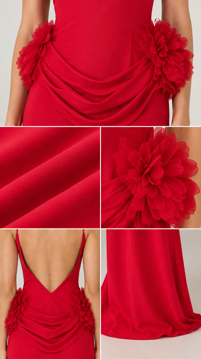 Close-up details of draped fabric folds and 3D floral appliqués on the gown