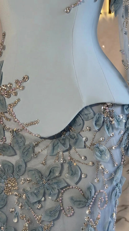 Close up of beaded 3D floral lace appliqué and sculpted peplum seam on formal dress