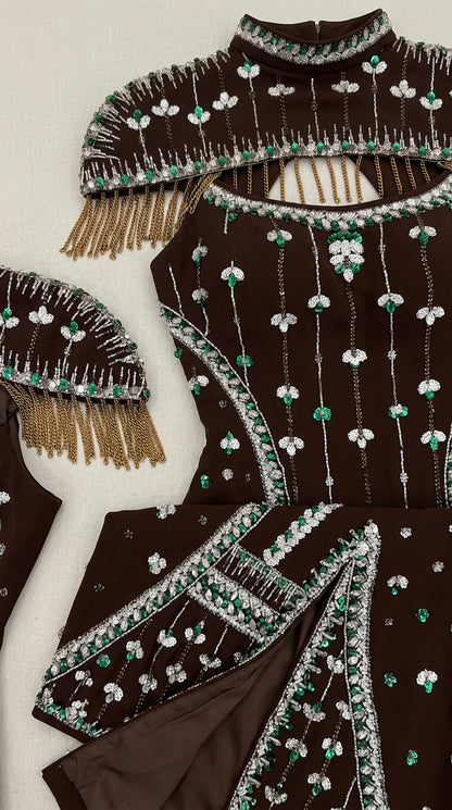 Close-up detail of high neckline, green crystal accents, beading, and fringe embellishment