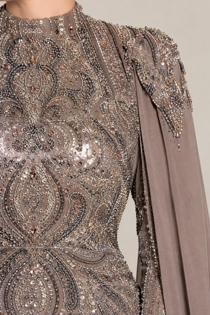 Close-up detail of intricate beadwork and sequin embroidery on high neckline and shoulder