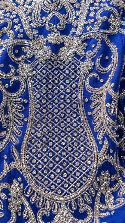 Close-up detail of intricate silver sequin and bead lattice embroidery