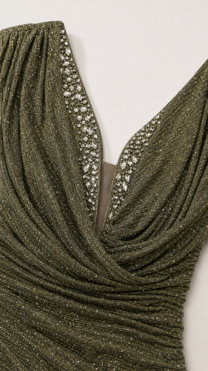 Close-up detail of draped cowl neckline and sparkling crystal rhinestone trim