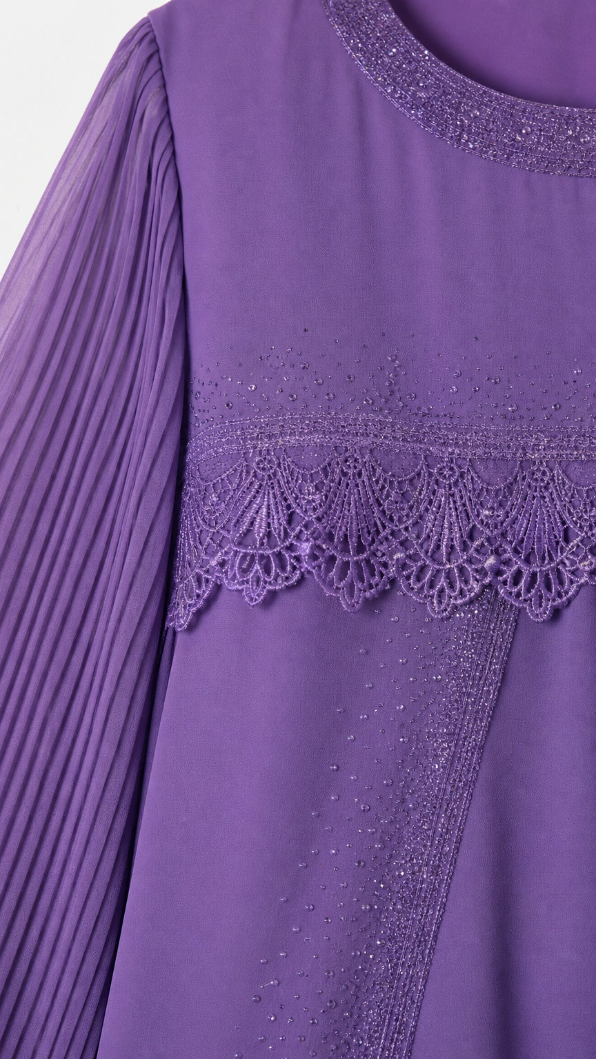 Close-up detail of purple dress neckline, beaded trim, lace embroidery, and pleated sleeve
