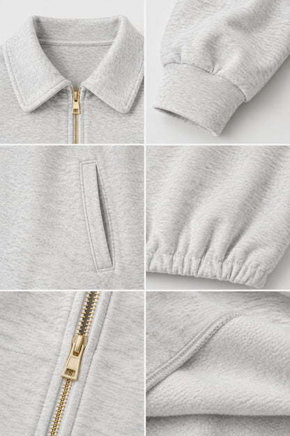 Close-up details of collar, metallic zipper, cuff, pocket, and soft fabric texture