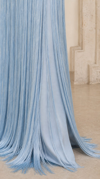 Close-up detail of cascading fringe hemline on Light Blue dress