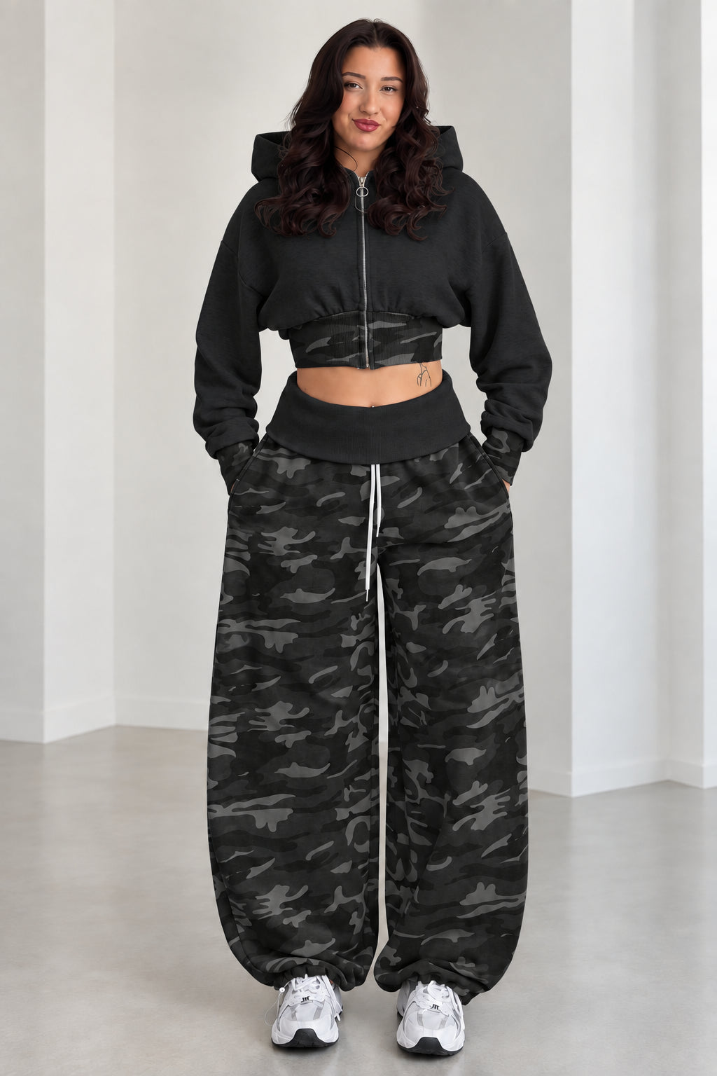Model wearing Black cropped zip hoodie and black camouflage wide-leg sweatpants set