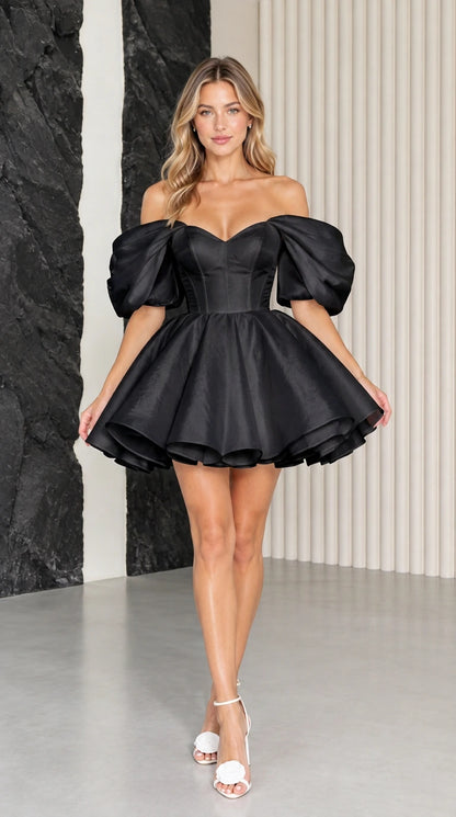 Model wearing black off-the-shoulder corset puff sleeve mini dress
