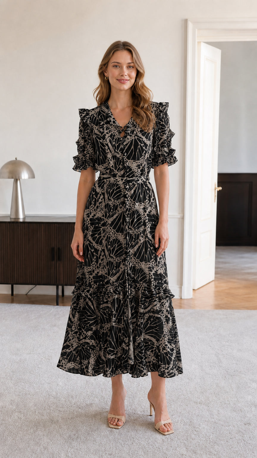 Model wearing black botanical print ruffle v-neck midi dress