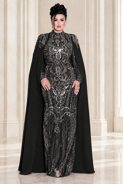 Model wearing black sequin embroidered high neck cape formal gown