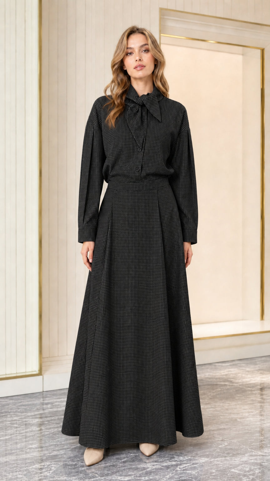 Model wearing black houndstooth long sleeve tie-neck maxi dress